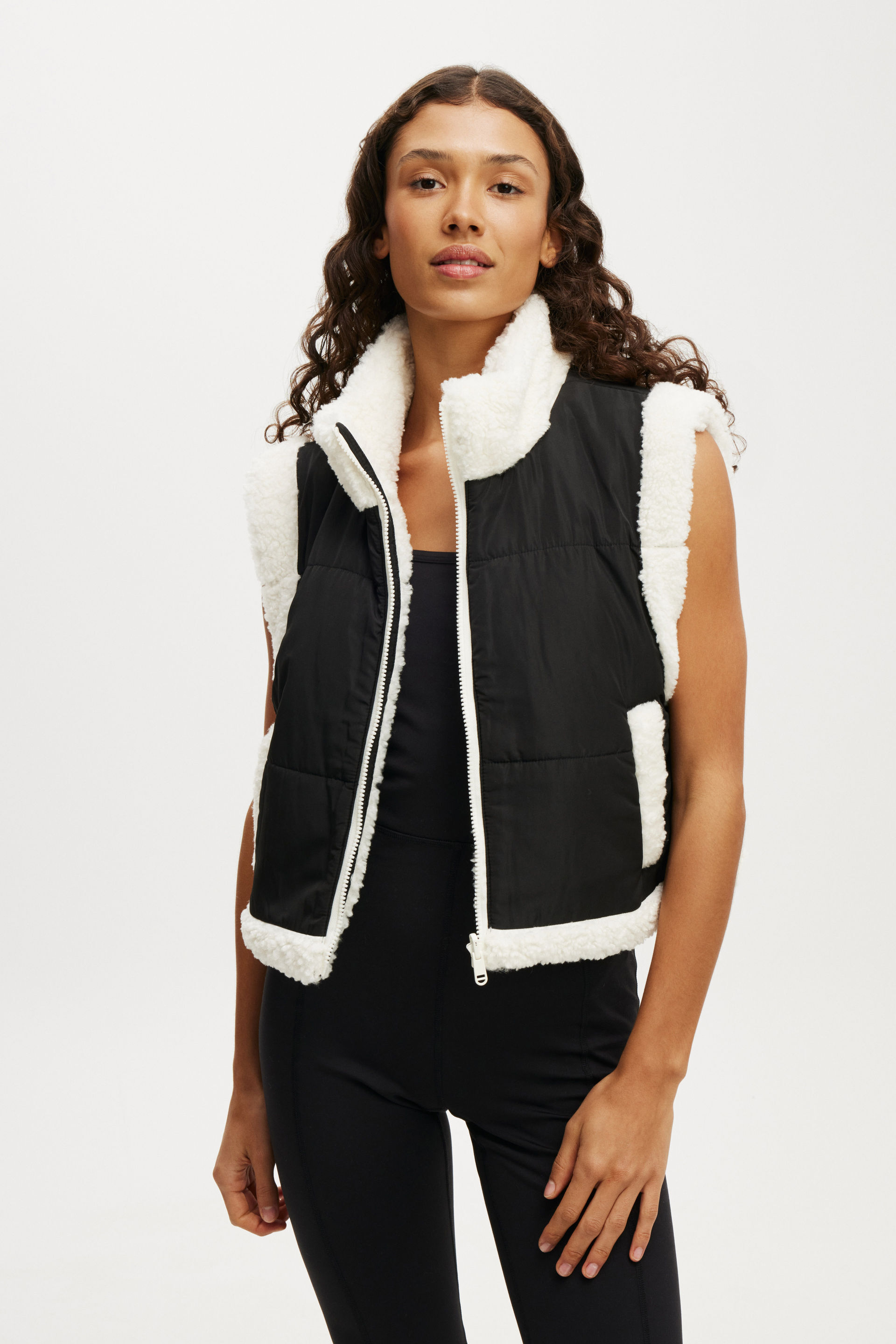 11589-mother-puffer-sherpa-reversible-vest-black-coconut-milk-1.jpg