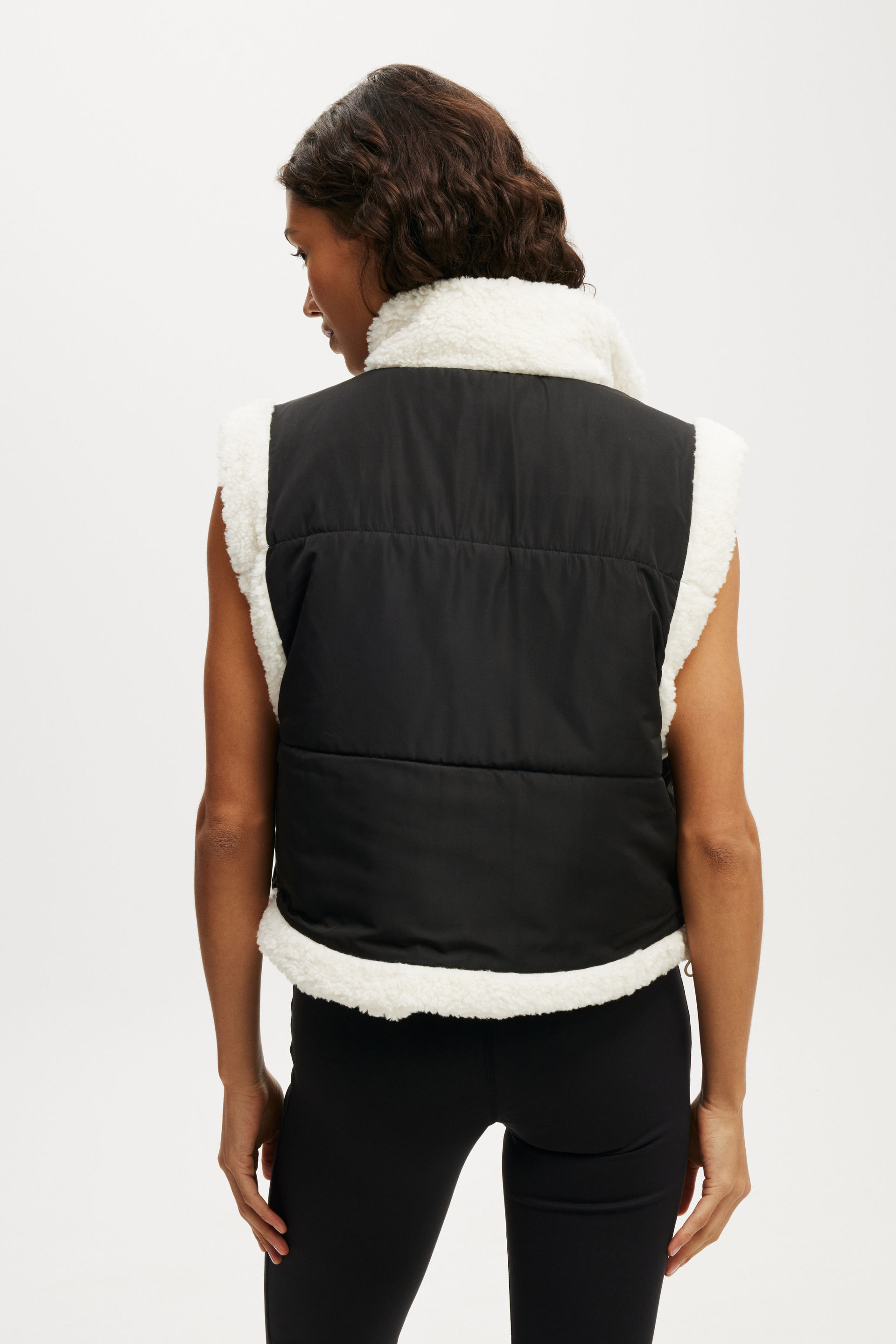 11589-mother-puffer-sherpa-reversible-vest-black-coconut-milk-1.jpg