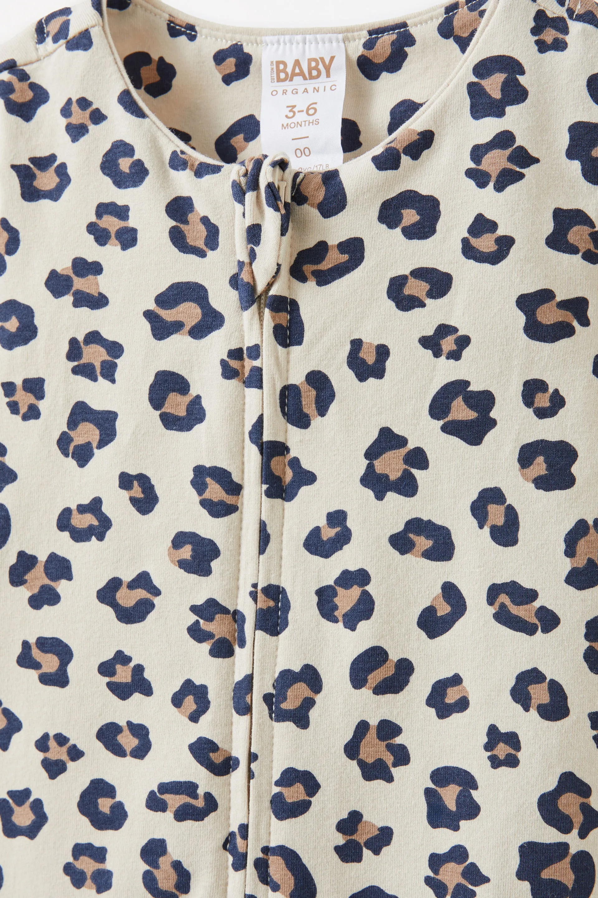17200-the-billie-short-sleeve-zip-romper-rainy-day-animal-spots-1.jpg