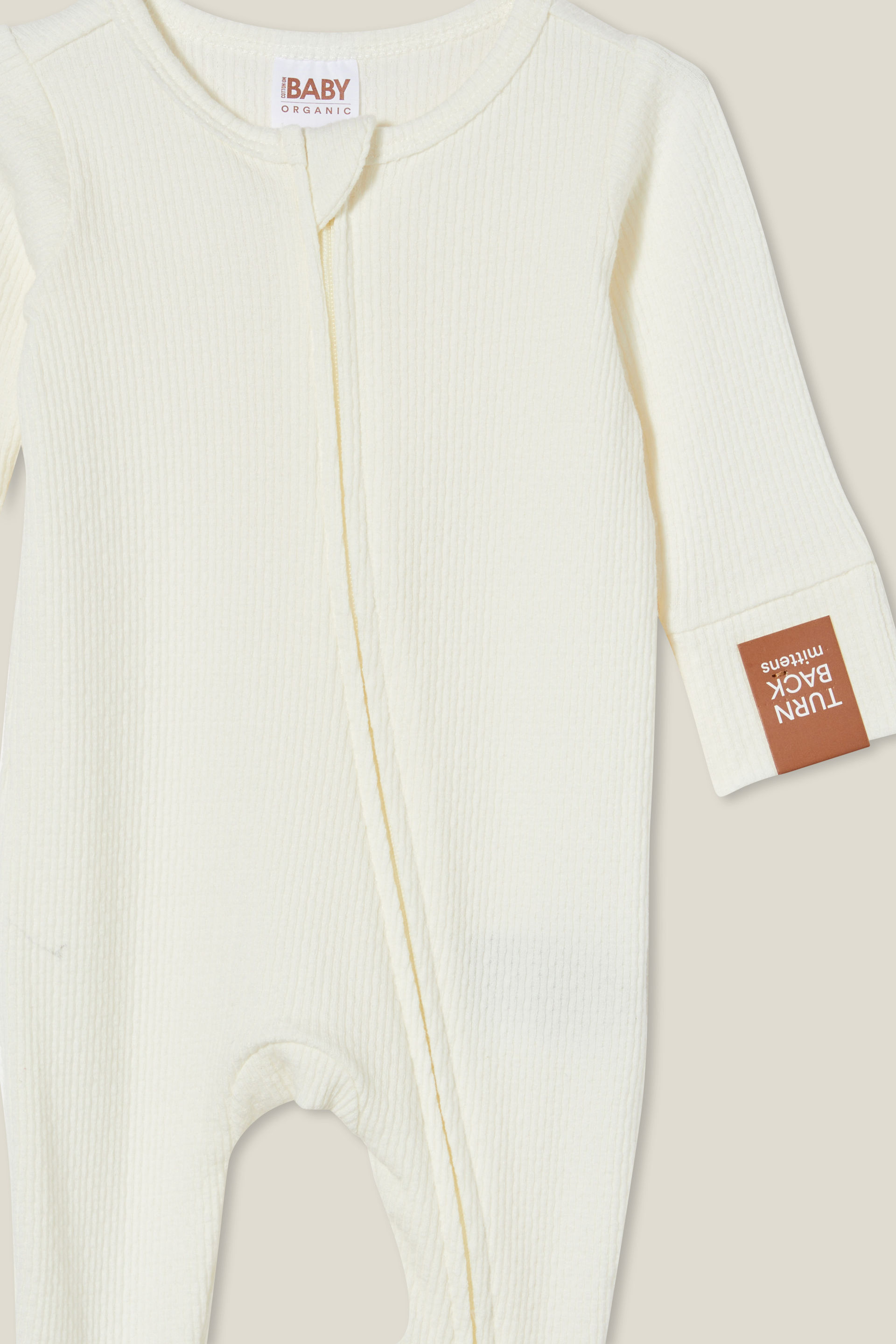19933-organic-pointelle-zip-all-in-one-romper-milk-1.jpg