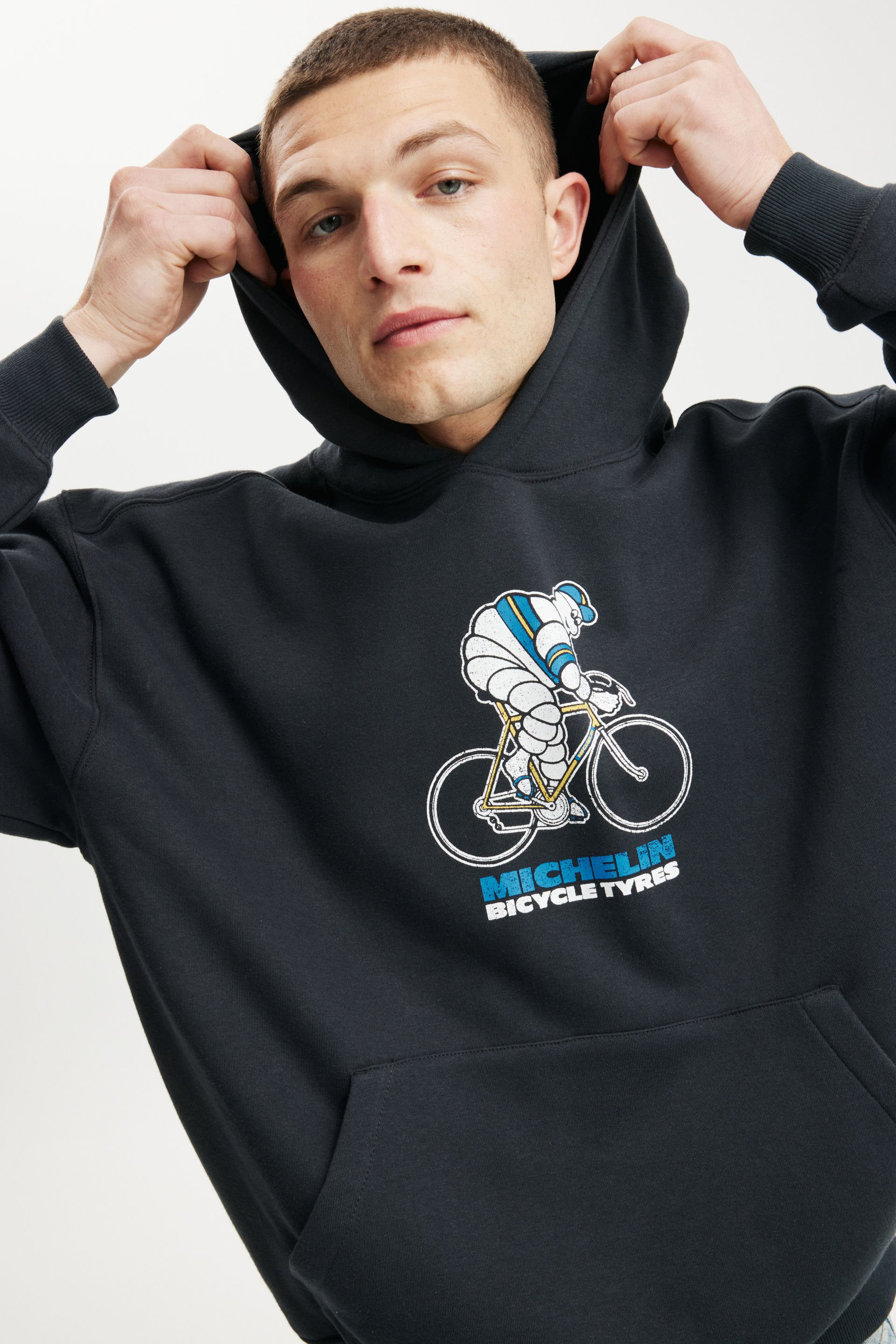 7776-michelin-box-fit-hoodie-lcn-mic-washed-black-michelin-cyclist-1.jpg